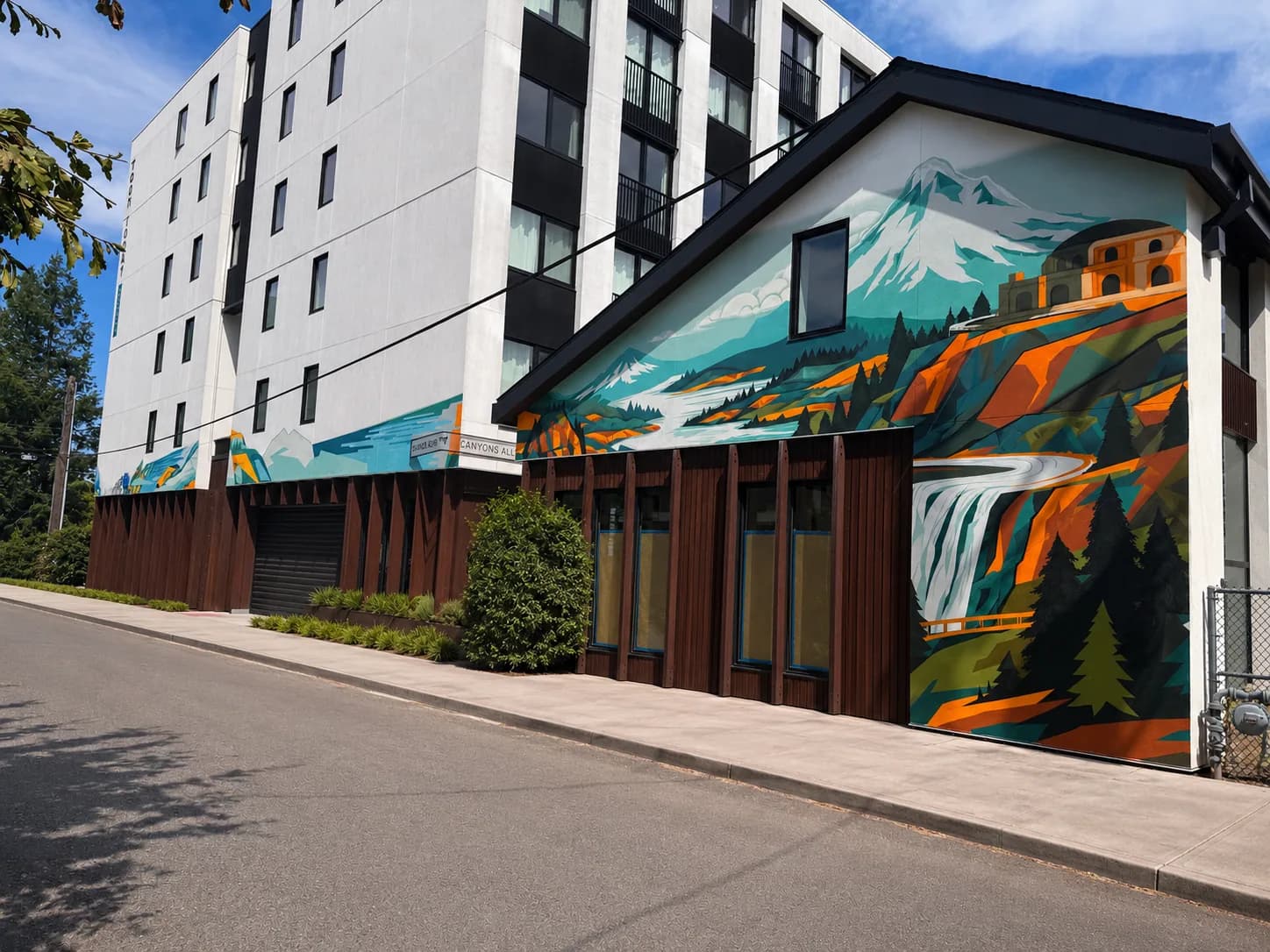 Large-scale exterior mural at The Canyons in Portland